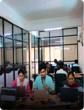 Collaborative workspace with glass partitions at KITEZ