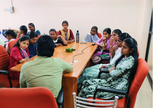 KITEZ mentors and students in a team meeting